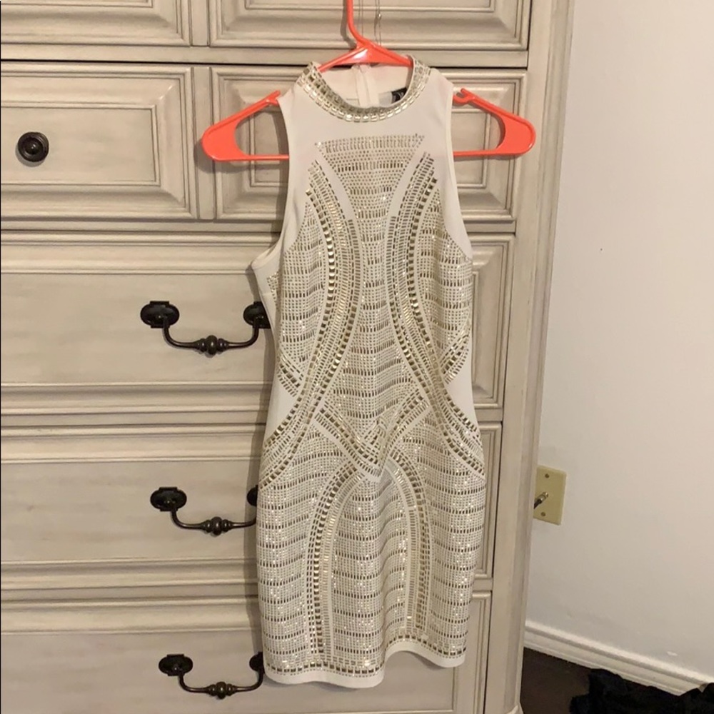 White dress with gold embellishments. Never worn